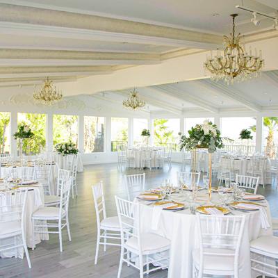 Spacious venue with fully set tables.