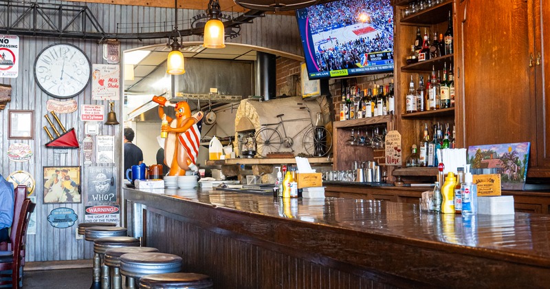 Bar, chairs, drink rack, side view