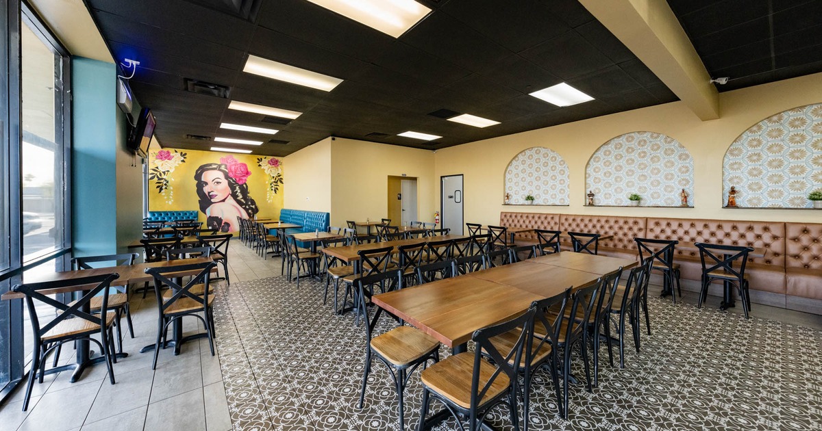 Interior, seating area, black and white decorative floor tiles, two doors in the back