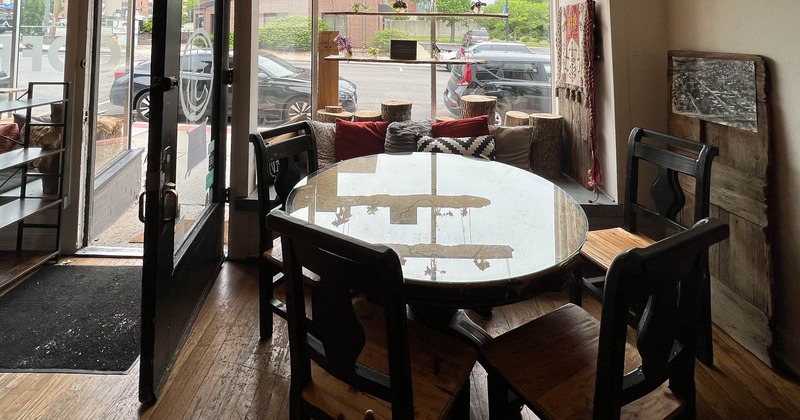 Interior, a table and seating near the entrance