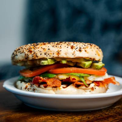 Everything Bagel with fried egg patty, cheese, bacon, spinach, tomato, avocado and pesto mayo.