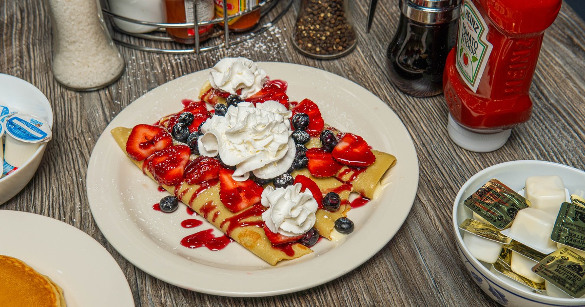 Berry crepe topped with whipped cream