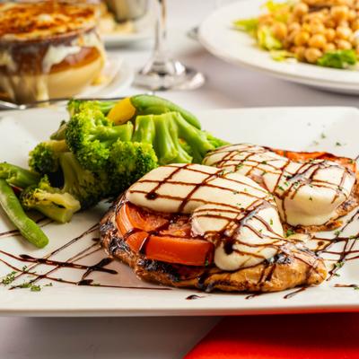 Chicken caprese sandwich with balsamic drizzle and a side of broccoli
