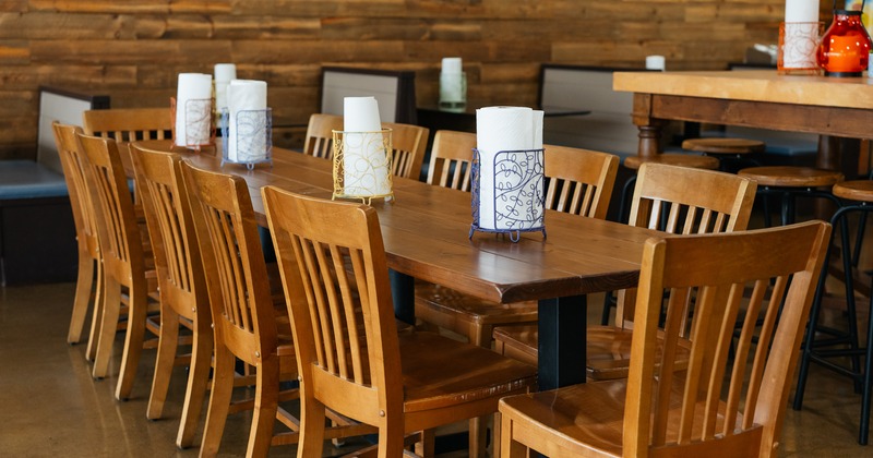 Wooden table for twelve guests, close up