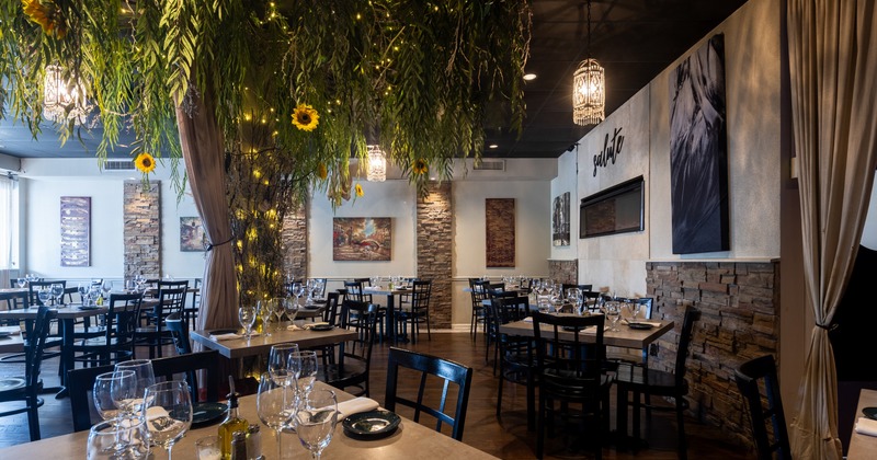 Interior, elegant dining area with decorative tree in the middle