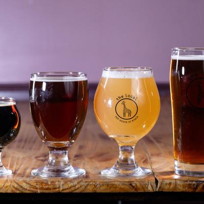 Glasses of craft beer on a wooden table.