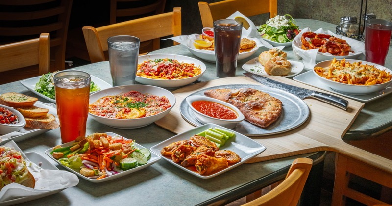 A table full of assorted dishes and drinks