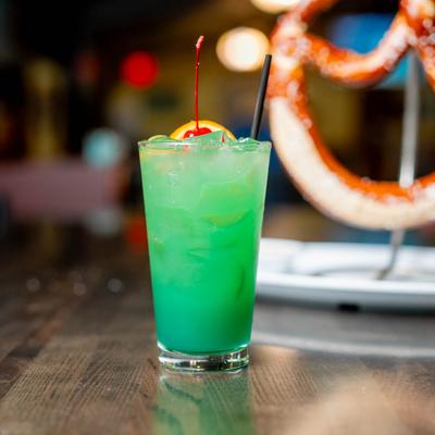 Mai Blue Tai cocktail with cherry and orange slice garnish.