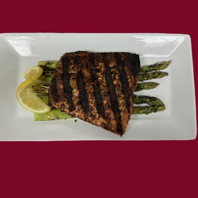 Blackened fish with asparagus and lemon.