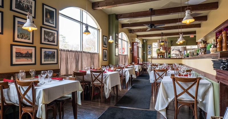 Interior, dining area, tables with tableware and glasses