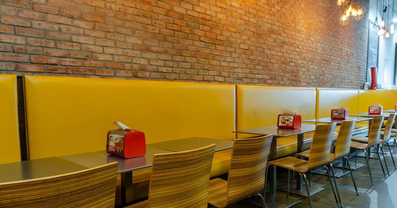 Interior, yellow booth seating area