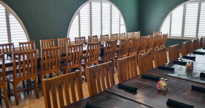 Interior, long tables ready for guests