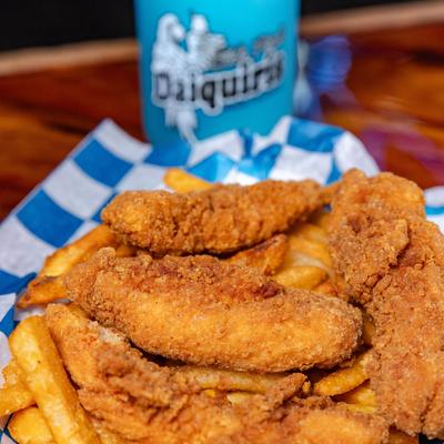 Chicken tenders served over fries.