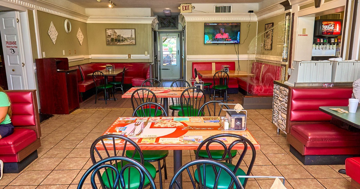 Interior, dining area, tables for four, seating booths, back entrance