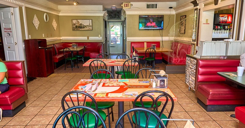 Interior, dining area, tables for four, seating booths, back entrance