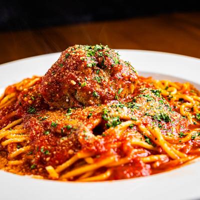 Spaghetti and meatball in red sauce.