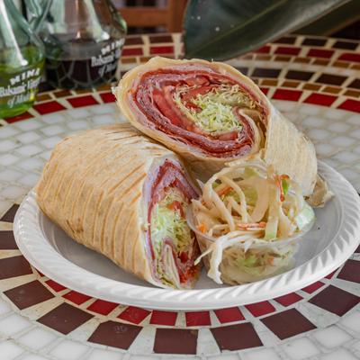 Italian Combo Wrap with ham, pepperoni, salami, and provolone cheese, served with coleslaw.