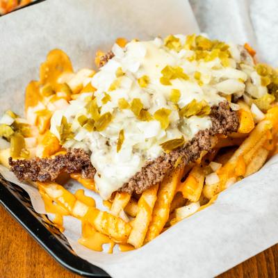 Furious Fries with chopped Angus beef, melted cheese, diced onions, and jalapeños.