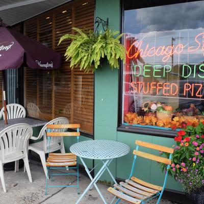 Exterior, coffee table and chairs in front the restaurant.