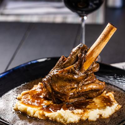 Braised Lamb Shank, with Porto sauce, mushrooms, and mashed potatoes.