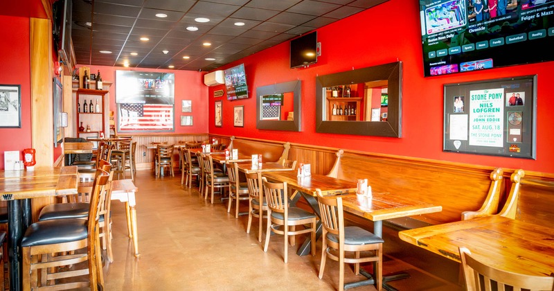 Interior, long banquette seating area, tables, chairs, decoration