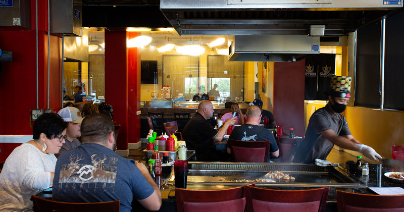 Interior, guests enjoying food and drinks