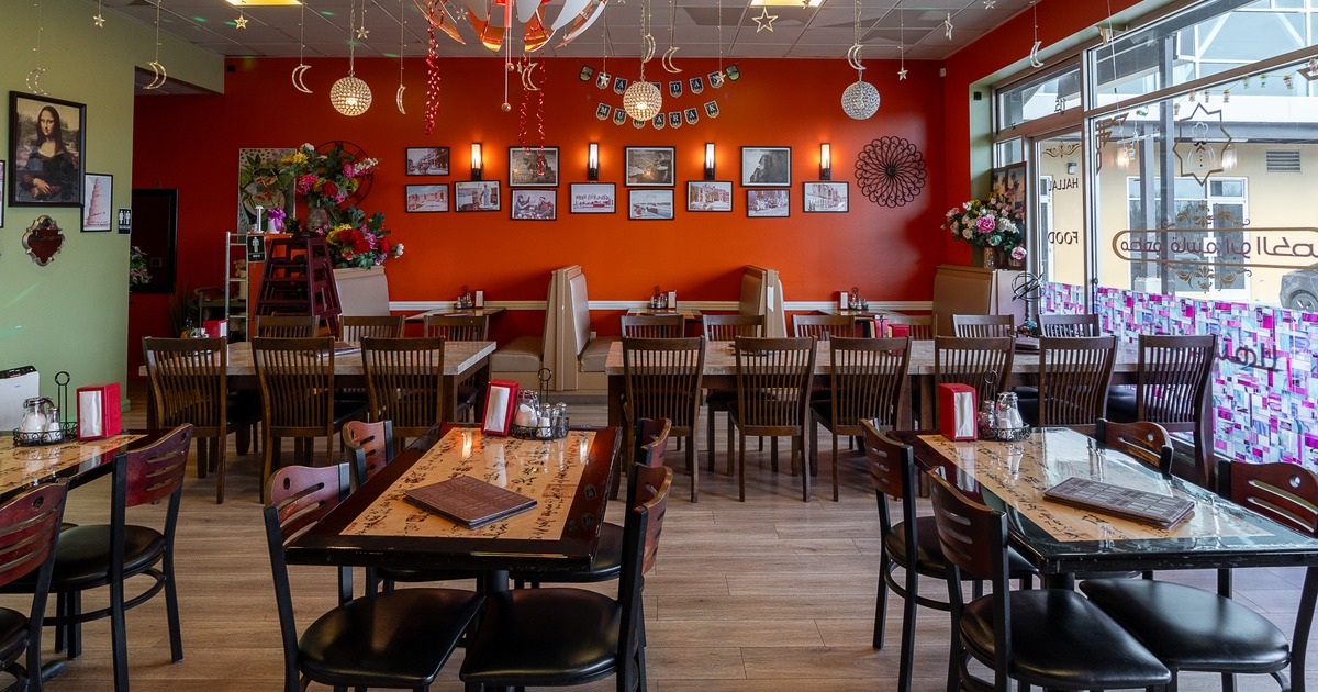 Spacious and cozy interior dining area with tables ready for guests