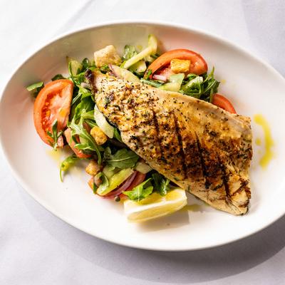 Grilled branzino, with vegetables.