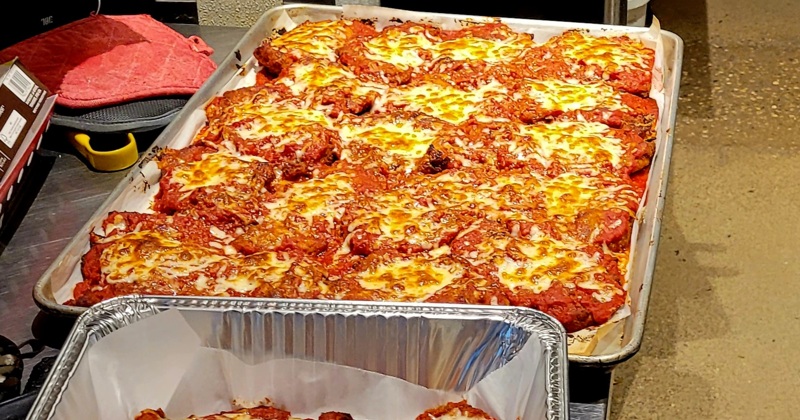 A large tray of baked lasagna