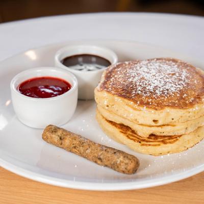 Slippers served with sauces and sausage.