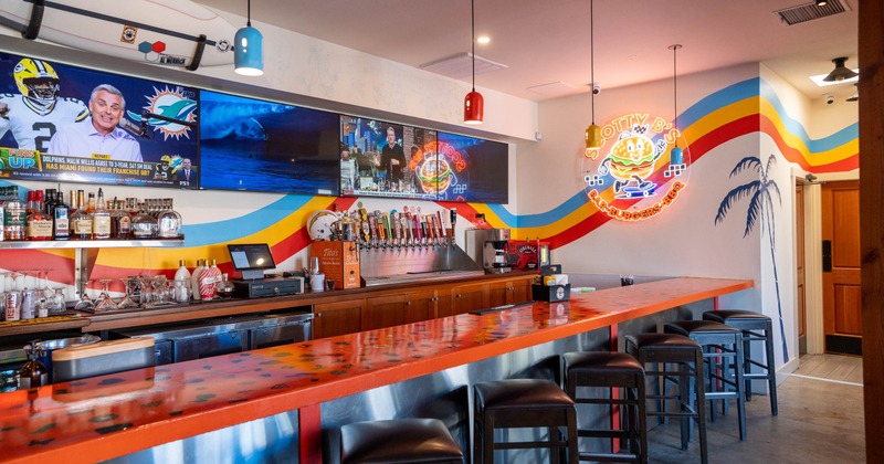 Colorful bar interior with a long vibrant counter
