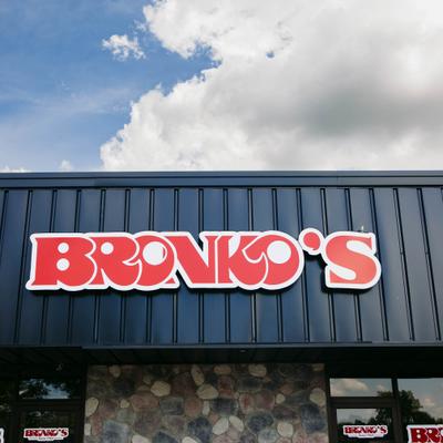 Restaurant logo displayed outside the restaurant entrance.