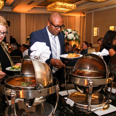 jai ho atlanta indian kitchen wedding catering, person grabbing a bite