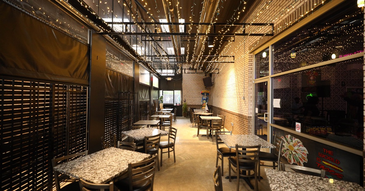 Cozy restaurant patio with ambient fairy lights hanging from the ceiling