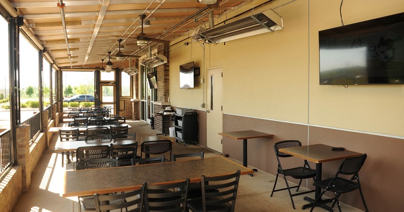 Exterior, covered patio with tables and chairs