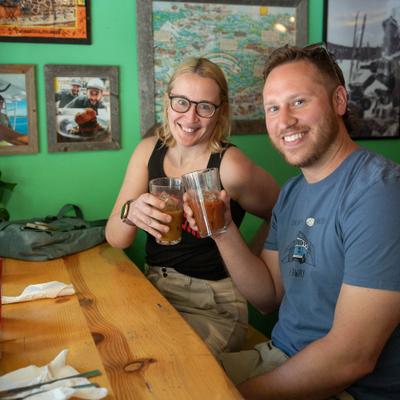 SMiling guests toasting with their drinks.
