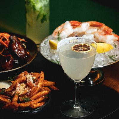 Margarita cocktail and food on the table.