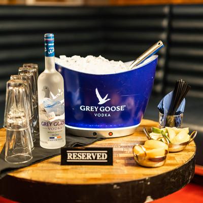 Bottle of drink served with ice bucket