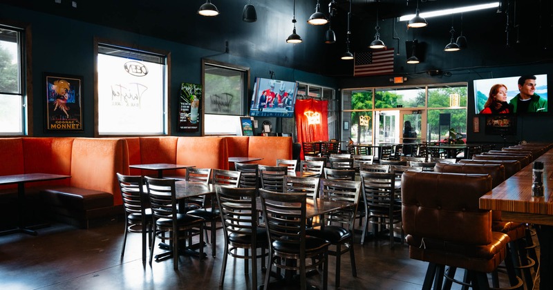 Interior, seating area with tables, chairs and booths