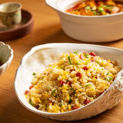 House Special Chinese Sausage Fried Rice served with other dishes.