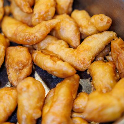 Close-up of fried chicken pieces.