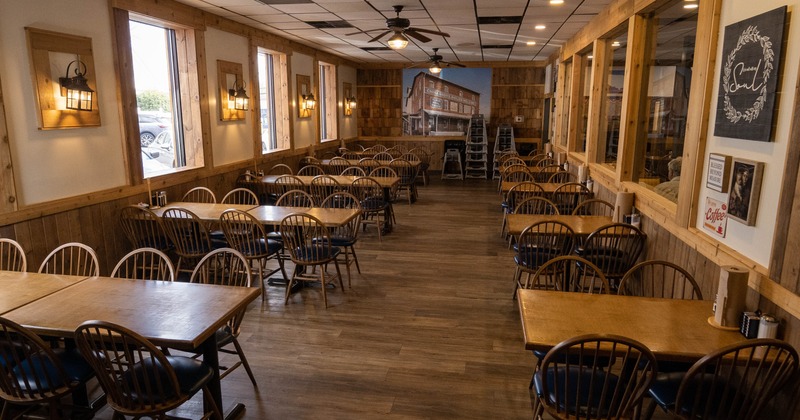 Interior, dining space with wooden tables and chairs