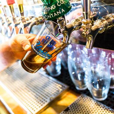 Pouring beer from the tap.