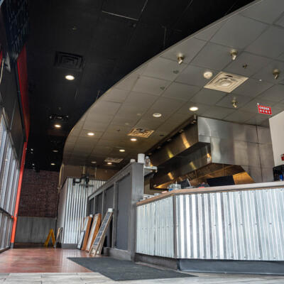 Interior view of Harp Barbecue featuring a corrugated metal counter.