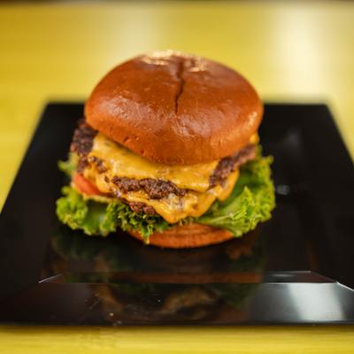Smash Burger featuring two beef patties, cheese, lettuce and tomato.