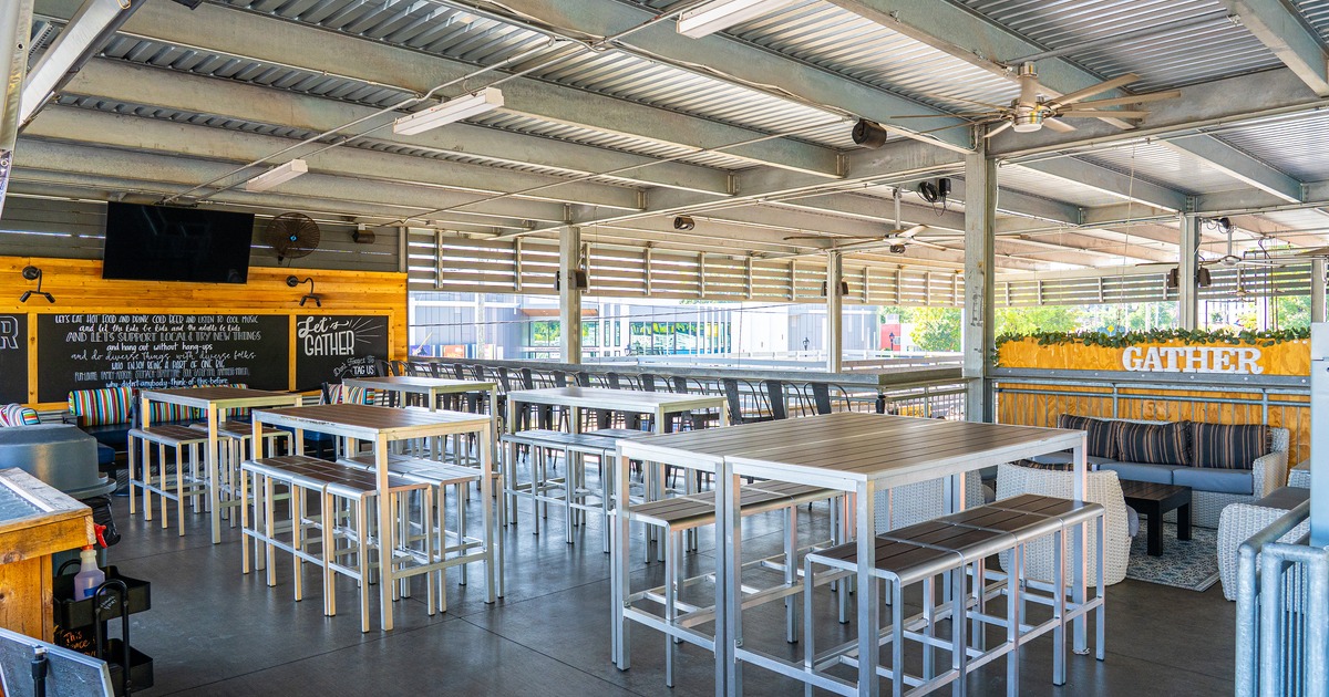 Seating area featuring high-top tables and chairs