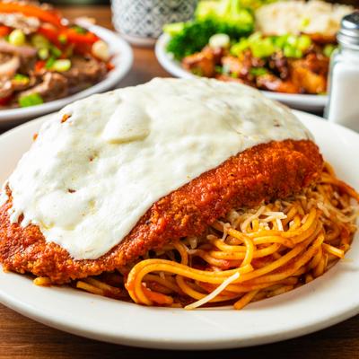 Chicken Parmesan with spaghetti, mozzarella, and marinara sauce.