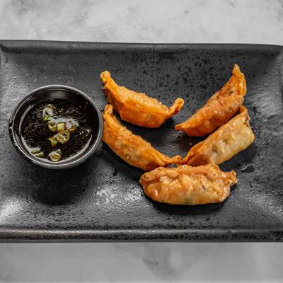 Fried dumplings and dip.