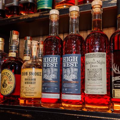 Assorted whiskey bottles on the shelves.