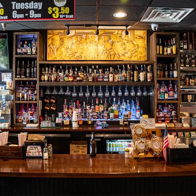 Bar and drink rack behind.
